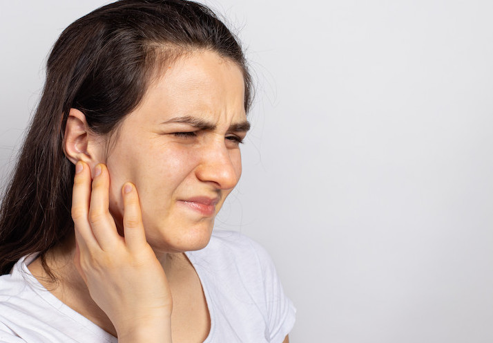 has a sore ear - infection, inflammation from infection and otitis.