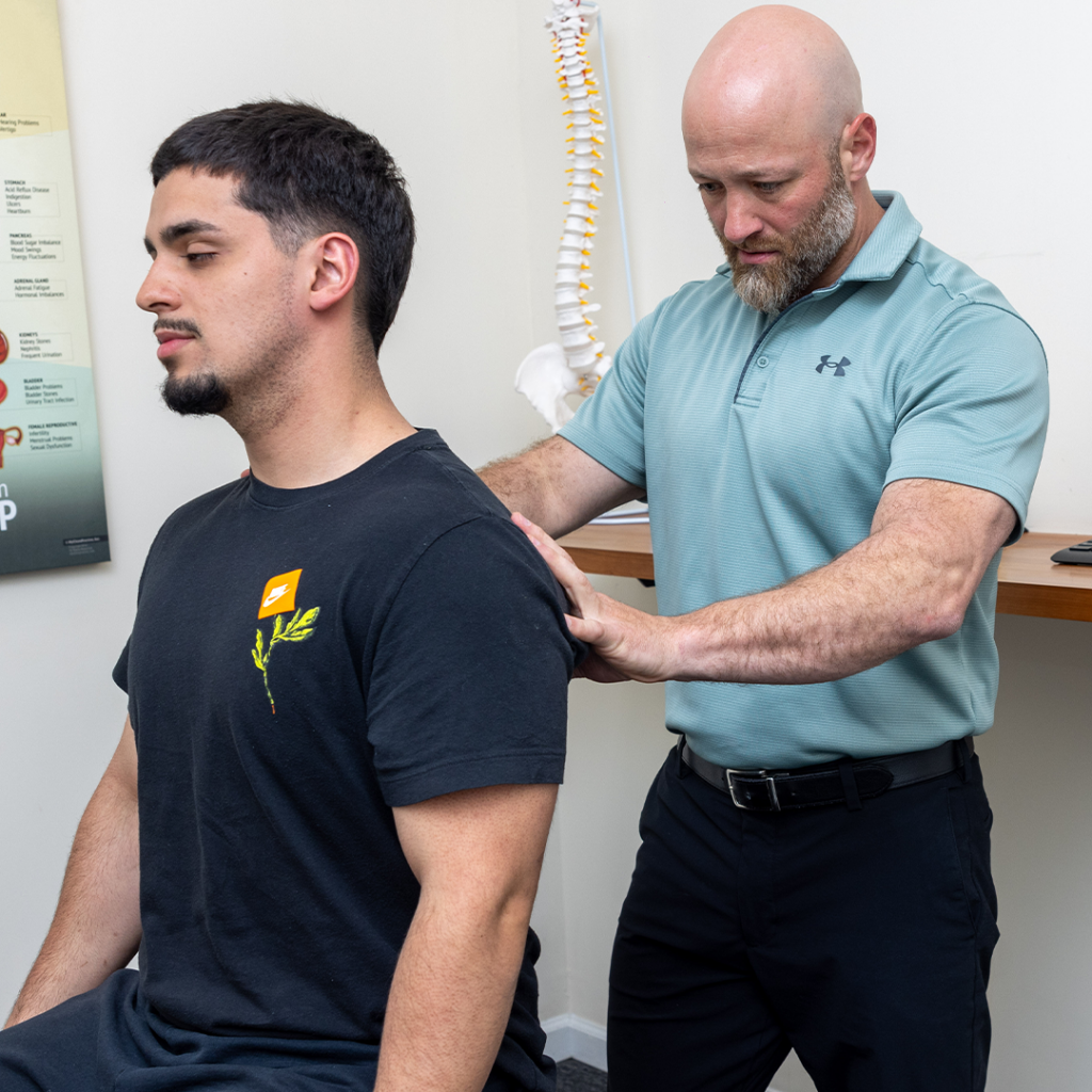 Dr. Eric Chludzinski, spinal decompression therapy on male patient