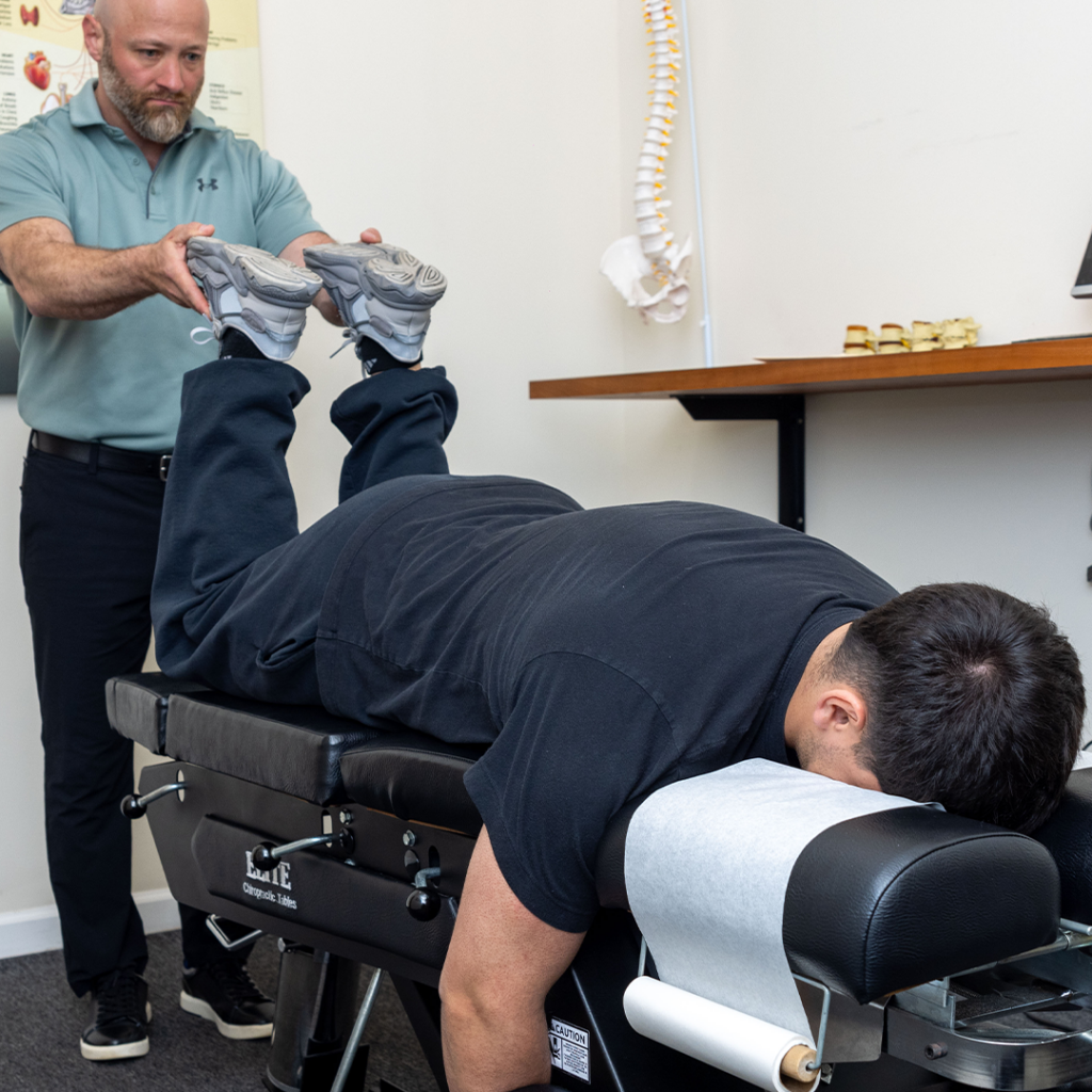 dr. eric checking on patients poor posture